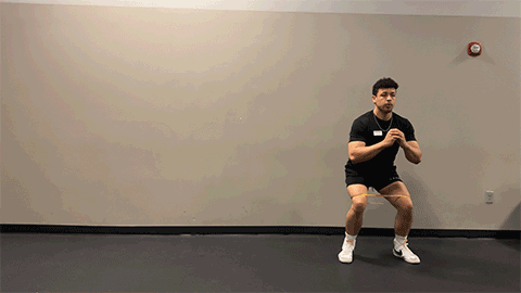 eos member performing a lateral walk with resistance band