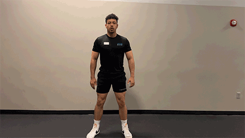 eos member performing a bodyweight squat