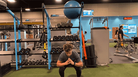 eos member performing a jump squat