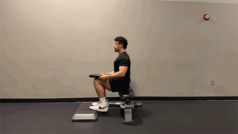eos member performing a seated calf raise