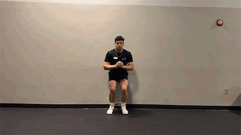 eos member performing a monster walk with resistance band