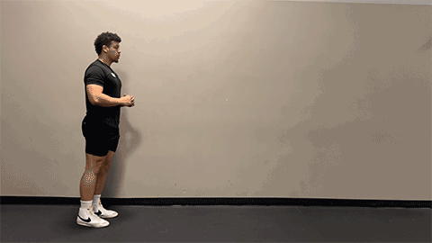 eos member performing a walking lunge