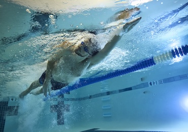 eos gym member swimming in a new and clean pool